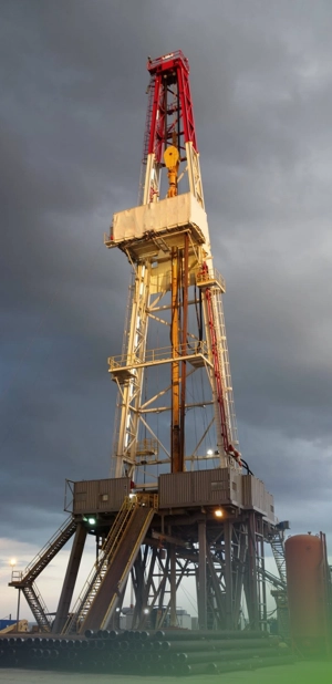Directional drilling rig under a cloudy sky